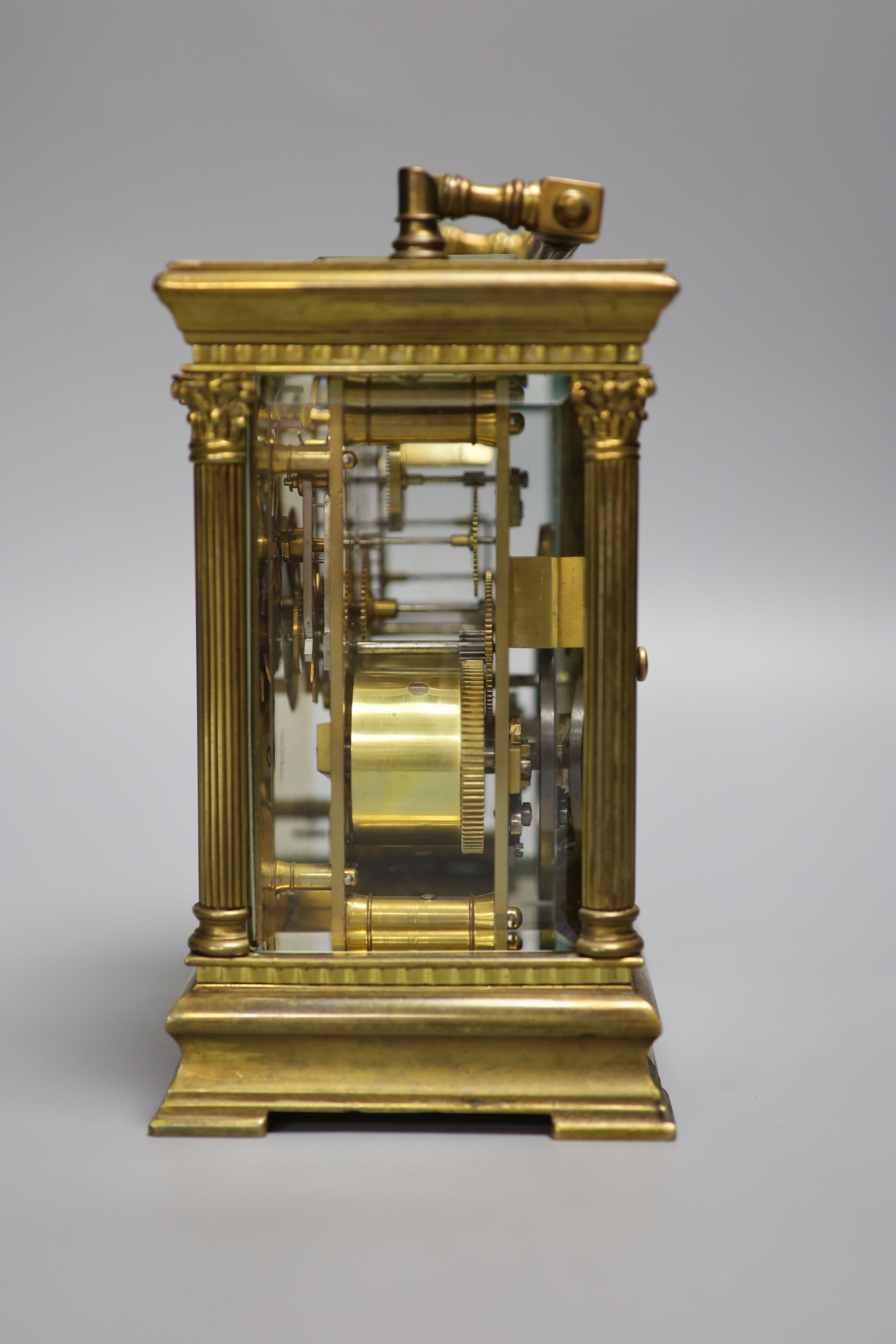 An Edwardian Corinthian brass repeating carriage clock, 20cm high to handle